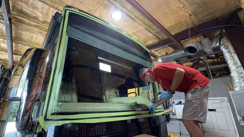 Absolute Auto Glass technician working on a motorhome windshield